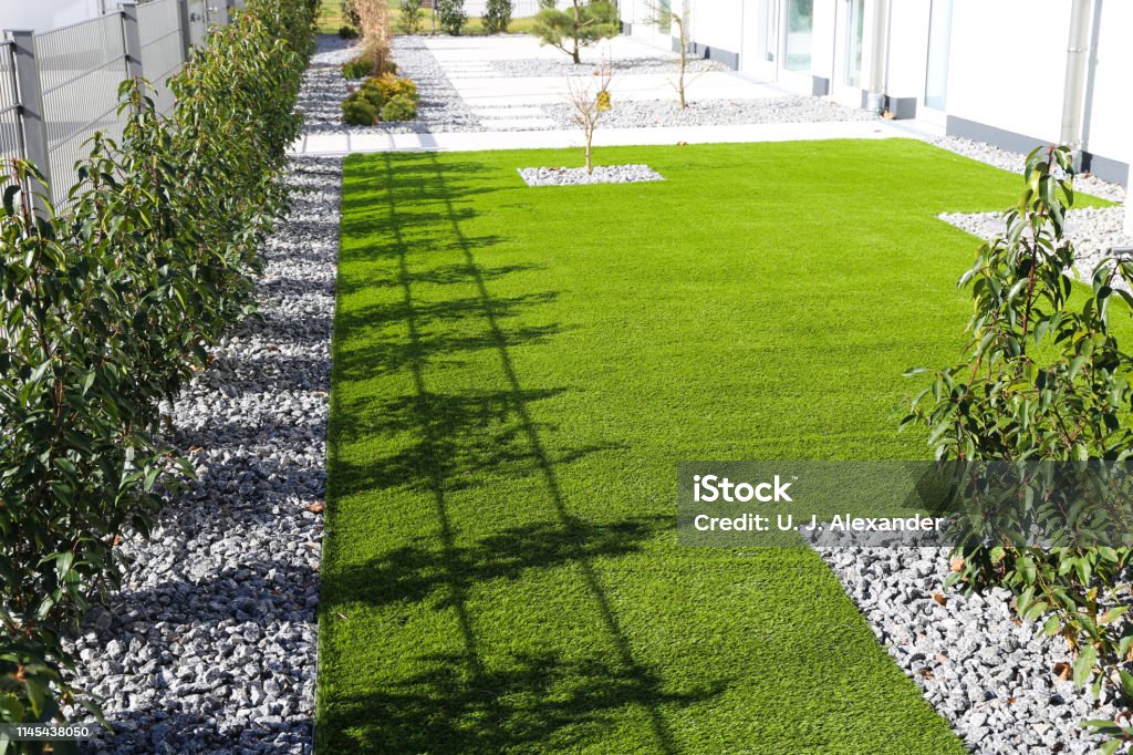 Back yard with very neat rolled turf Turf Stock Photo