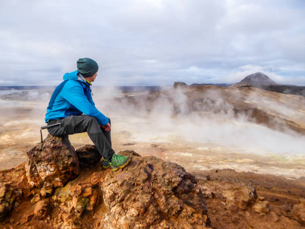 istock Iceland - Man and a geothermal region 1145438836