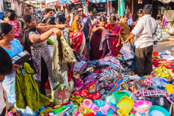 Local market shopping in India GOA, INDIA - APRIL 06, 2012: Indian dress and fabric at the local market in India india indian culture market clothing stock pictures, royalty-free photos & images