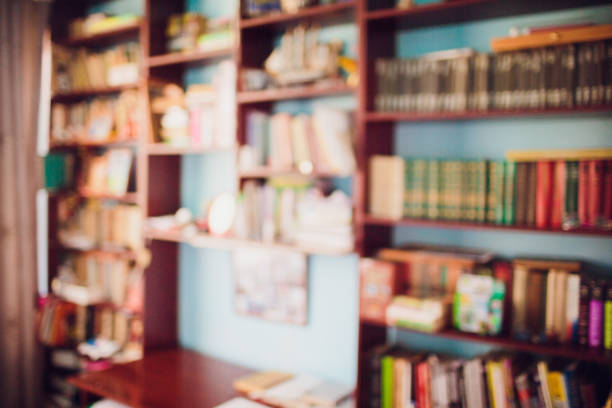 istock Books on bookshelf in library room, abstract blurred focused background 1145440770