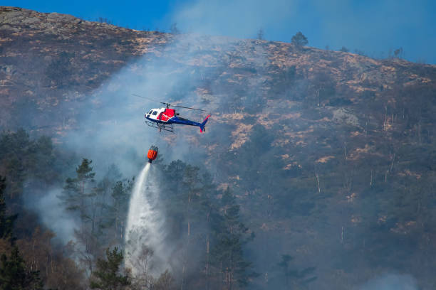 istock Helicopter extinguishing wildfire. Bergen, Norway. 1145444189