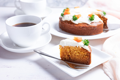 Carrot cake decorated with carrots on the top