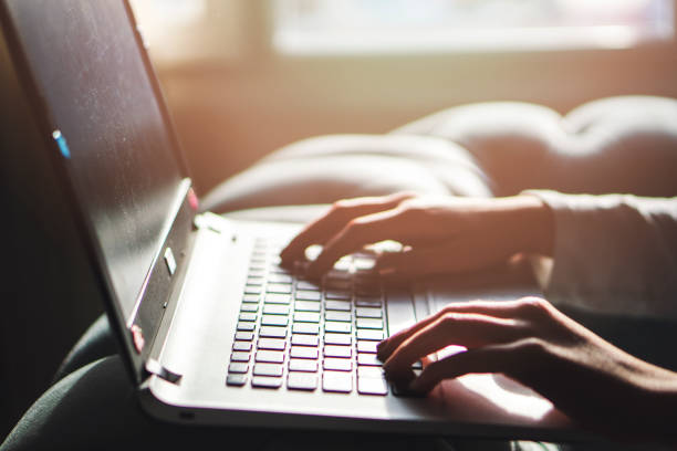 istock Girl working at home office hand on keyboard close up 1145447309