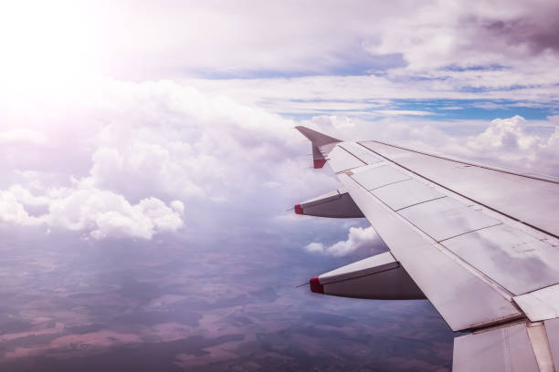 istock Airplane wing through the aircraft window. Greenhouse effect, global warming. 1145448559