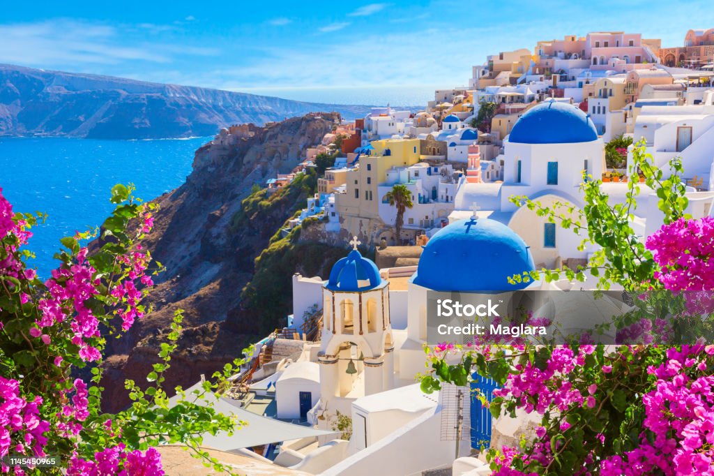 Santorini island, Greece. Santorini island, Greece. Oia town traditional white houses and churches with blue domes over the Caldera, Aegean sea. Greece Stock Photo