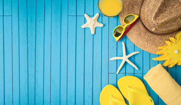 istock Summer holiday vacation background with beach accessories on wooden table. 1145451000