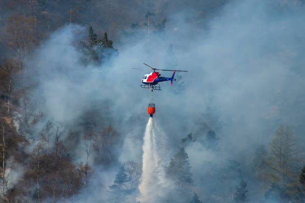 istock Helicopter extinguishing wildfire. Bergen, Norway. 1145451102