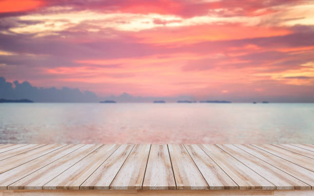 Empty wooden board with beautiful sunset for products display or visual design key layout