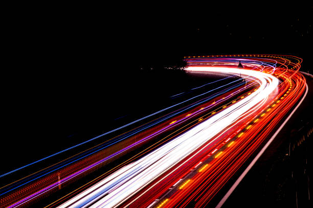istock lights of cars with night. long exposure 1145457724