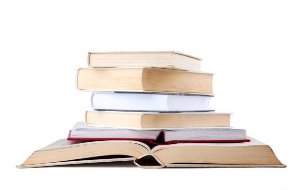 istock Stack of open and closed hardback cover books isolated on white background. 1145458443