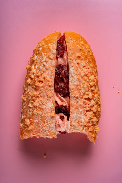 istock top view strawberry flavor bread with some bites on pink 1145459408