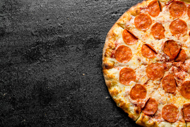 istock Sliced pepperoni pizza with salami. 1145459484