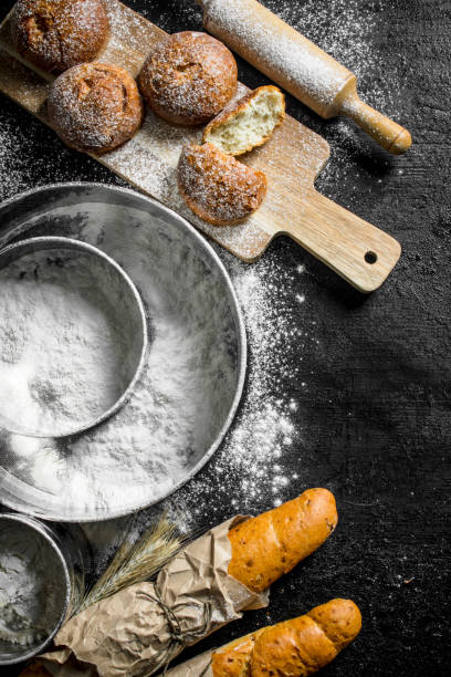 French baguette and fresh buns with flour.
