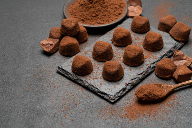 istock classic chocolate truffles on dark concrete background 1145459942