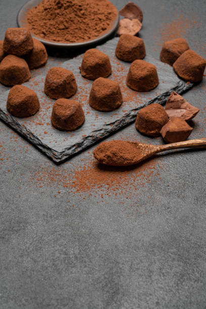 istock classic chocolate truffles on dark concrete background 1145459950