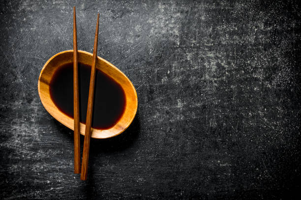 istock Soy sauce in a bowl with chopsticks. 1145461489