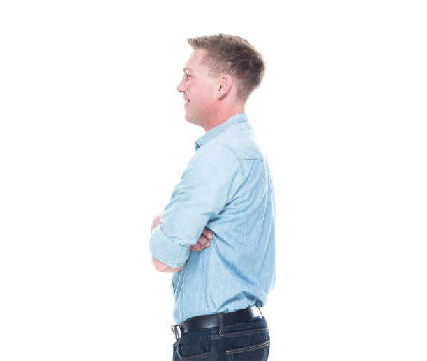 istock Handsome man standing with hands crossed 1145466184