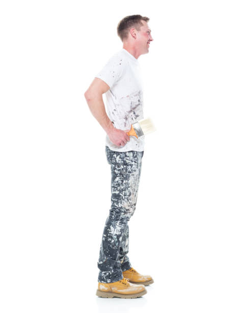 istock Handsome young white man who is a painter - hands on hips 1145466338
