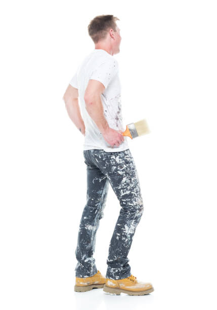 istock Handsome young white man who is a painter - hands on hips 1145466339
