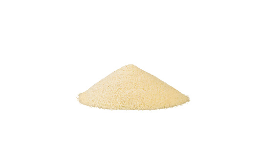 semolina heap isolated on white background. nutrition. natural food ingredient. front view.