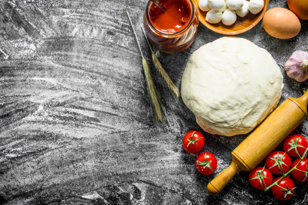 istock Preparation pizza. Various ingredients for cooking pizza. 1145467468