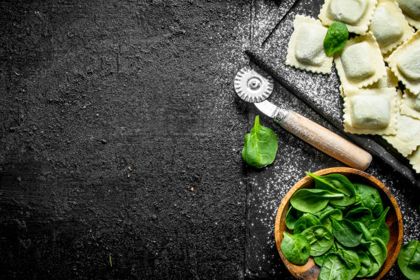 istock Italian Ravioli raw with greens. 1145467840