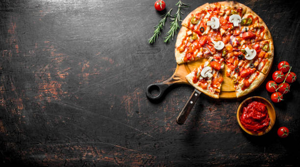 istock Mexican pizza with rosemary and tomato paste in bowl. 1145469866