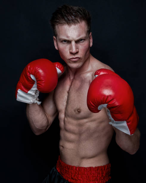 istock Sexy male boxer on black background 1145470803