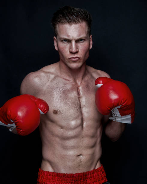 istock Sexy male boxer on black background 1145470814