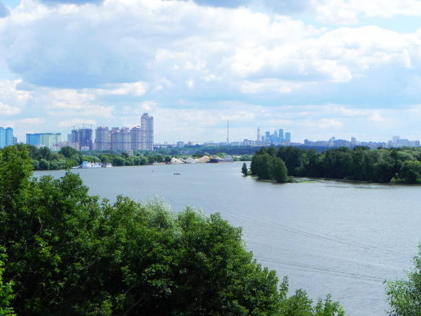 istock River flowing in the city. 1145472273