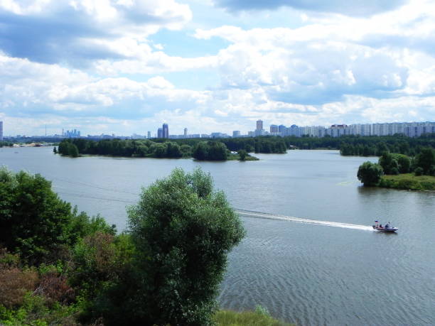 istock River flowing in the city. 1145472323
