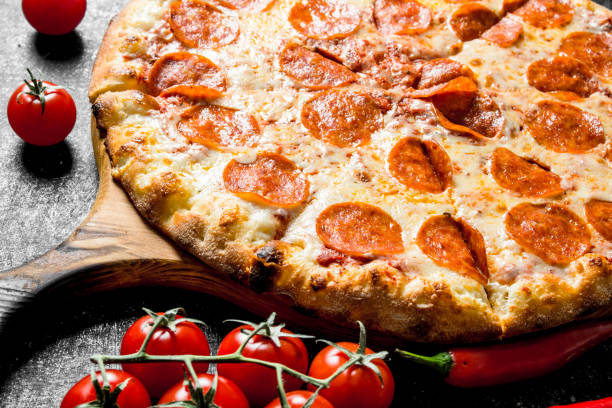 istock Crispy pepperoni pizza with sausages and cheese. 1145472590