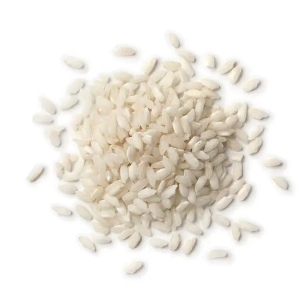 Heap of Italian Carnaroli risotto rice isolated on white background