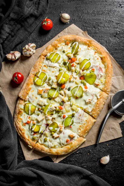 istock Pizza with vegetables and cheese sauce. 1145475155