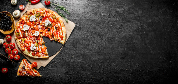 istock Fragrant sliced Mexican pizza with mushrooms and tomatoes. 1145476816
