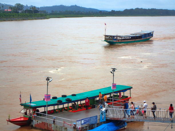 Wiang, Golden Triangle, Chiang Rai Province, Thailand, 16 july 2016 : boat on Mekong river, and jetty for carrying tourists from Thailand to Laos at the other side of the river.