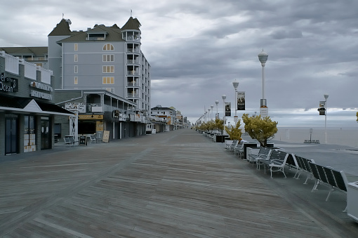 Ocean city boardwalk on a gray spring morning under cumulus clouds as seen using an IR sensor to provide a bit of a retro look with softened features