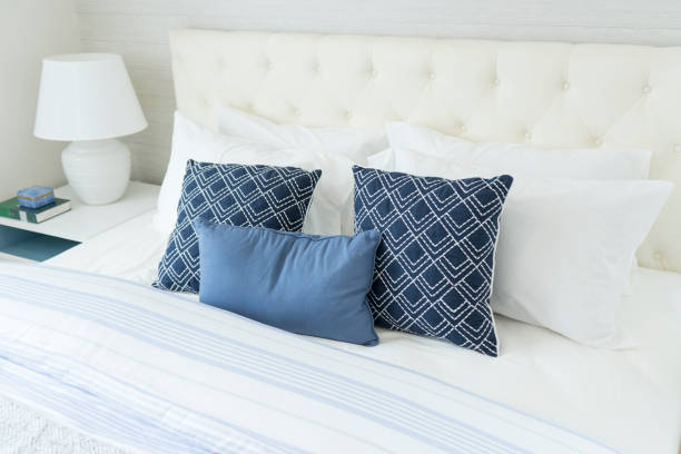 istock beach blue pillow on bed with side table lamp in bedroom 1145479174