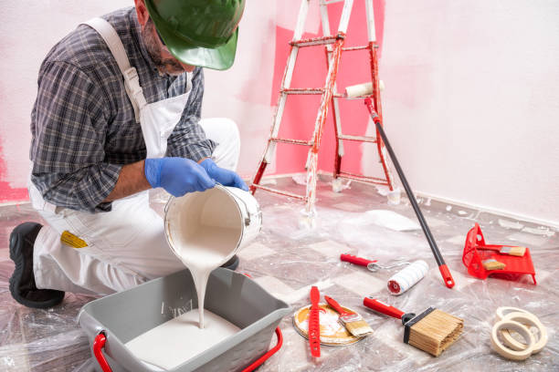 istock House painter worker at work in the construction site. Building. 1145479283