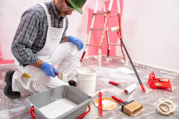 istock House painter worker at work in the construction site. Building. 1145479288