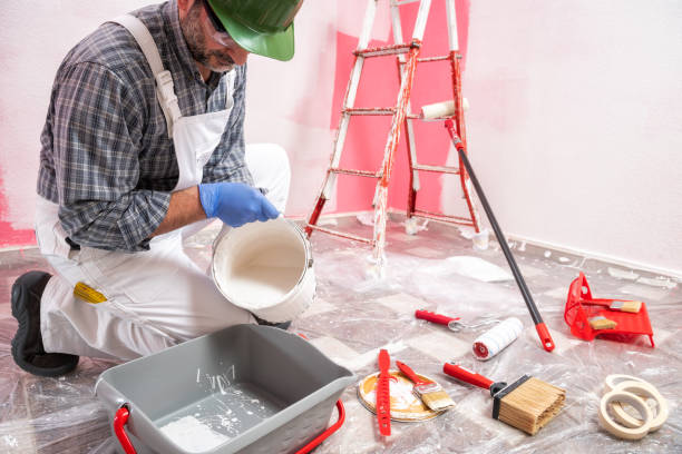 istock House painter worker at work in the construction site. Building. 1145479289