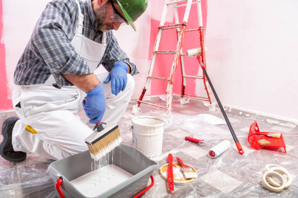 istock House painter worker at work in the construction site. Building. 1145479293