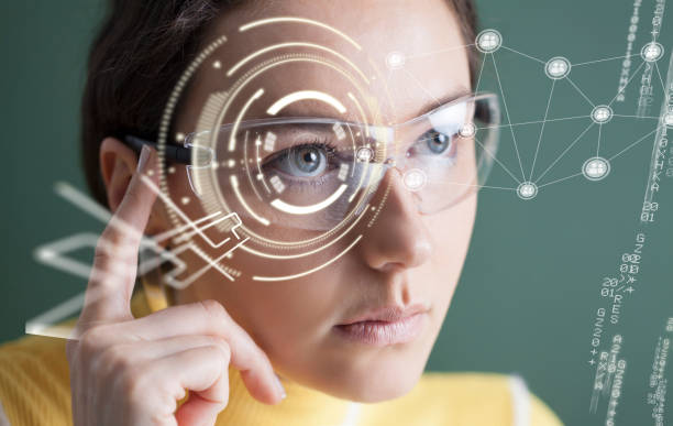 istock Woman in glasses with virtual screen 1145480637