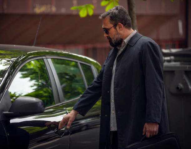 istock Businessman opening his black car 1145482741