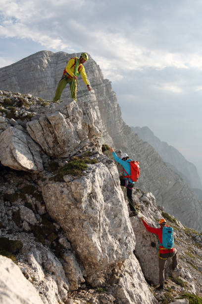 istock Group of mountain climbers on their way to the top 1145483258