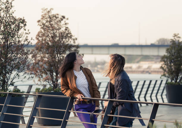 istock Friends by the river on a windy day 1145484461