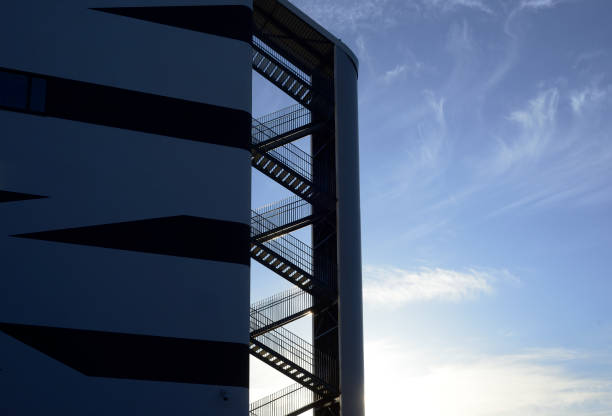 metal fire escape on a background of blue sky