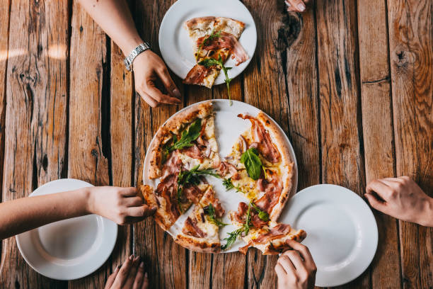 istock Overhead pizza carbonara on rustic wooden table 1145489247