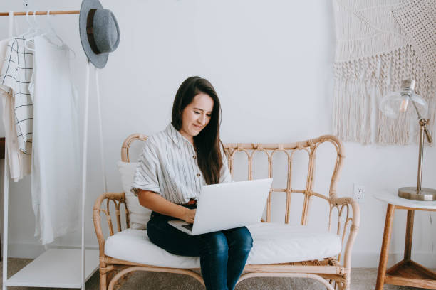 istock Young woman working from home on laptop computer 1145489323