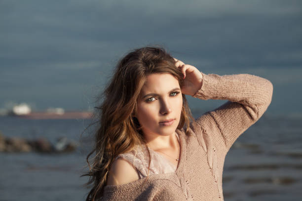 istock Nice woman on ocean background, portrait 1145492184